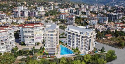Apartments in a complex with beach shuttle service in the center of Alanya